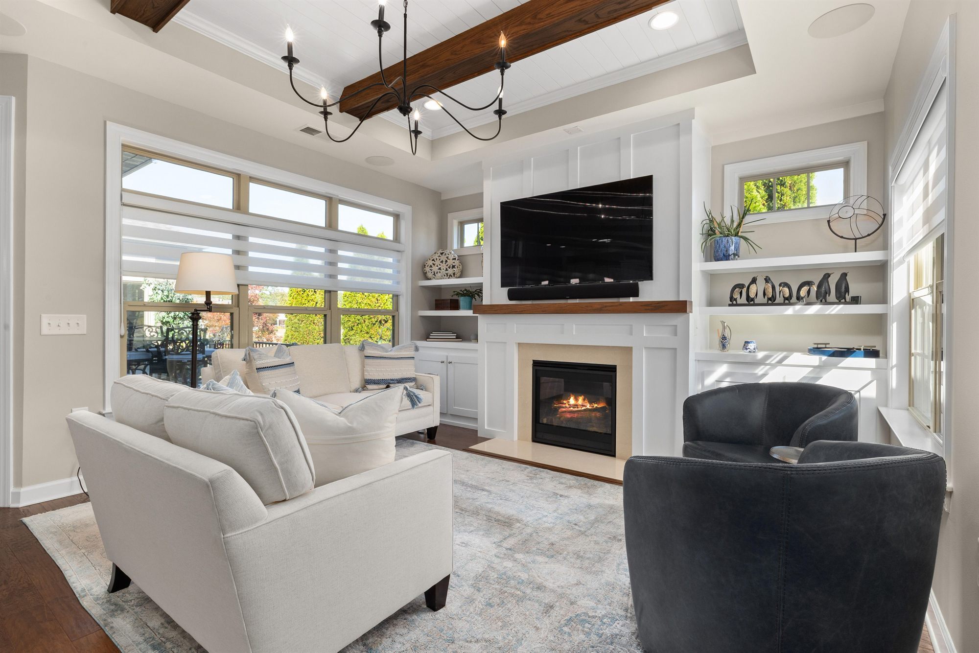 living-room-fireplace-tv-navy-chairs-stock