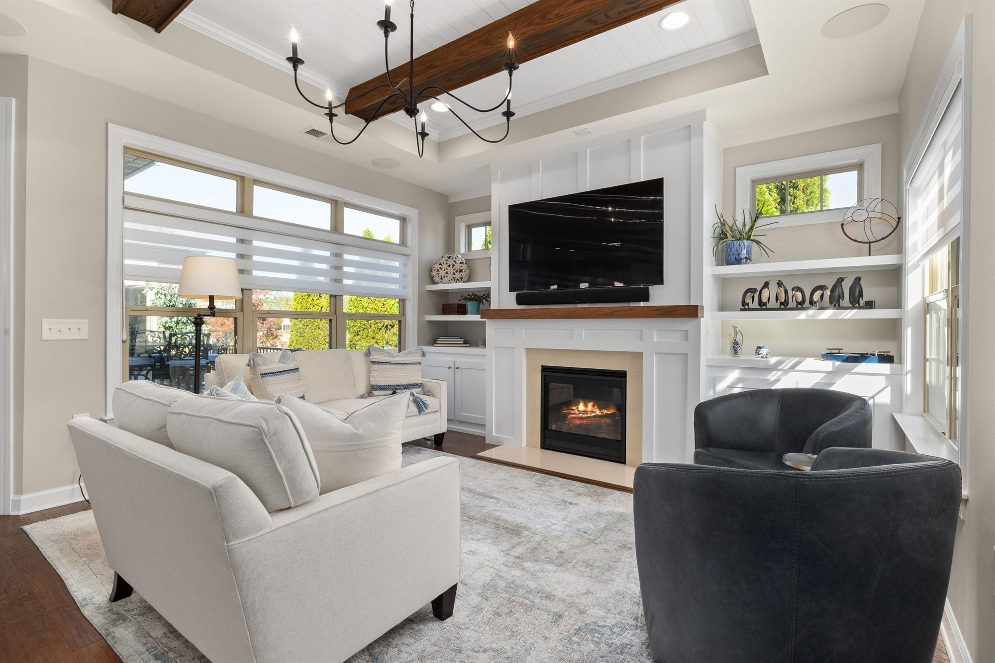 living-room-fireplace-tv-navy-chairs-stock