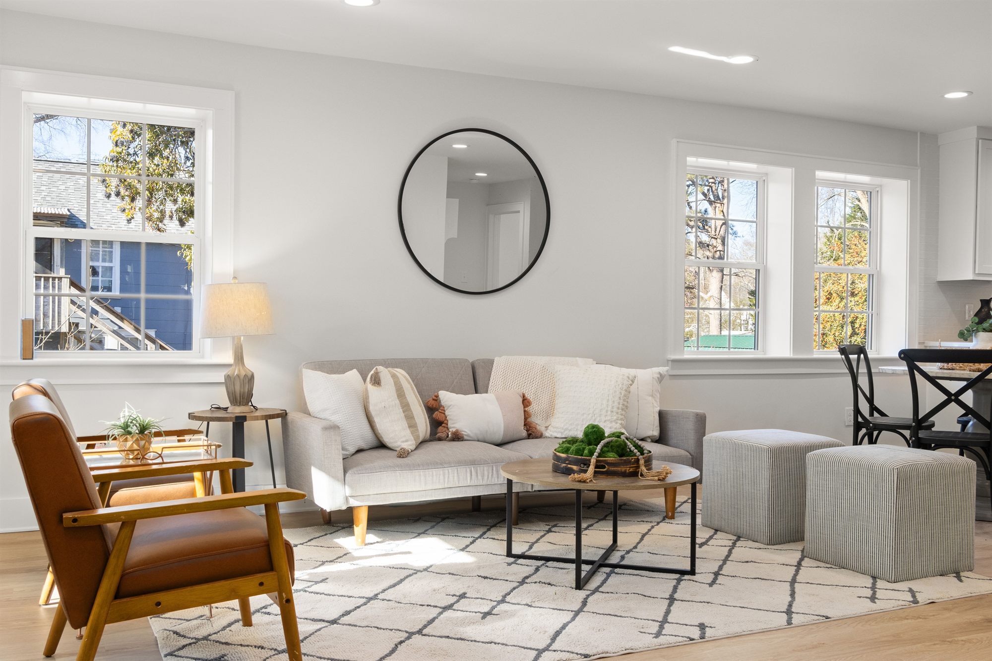 living-room-round-mirror-gray-sofa-stock