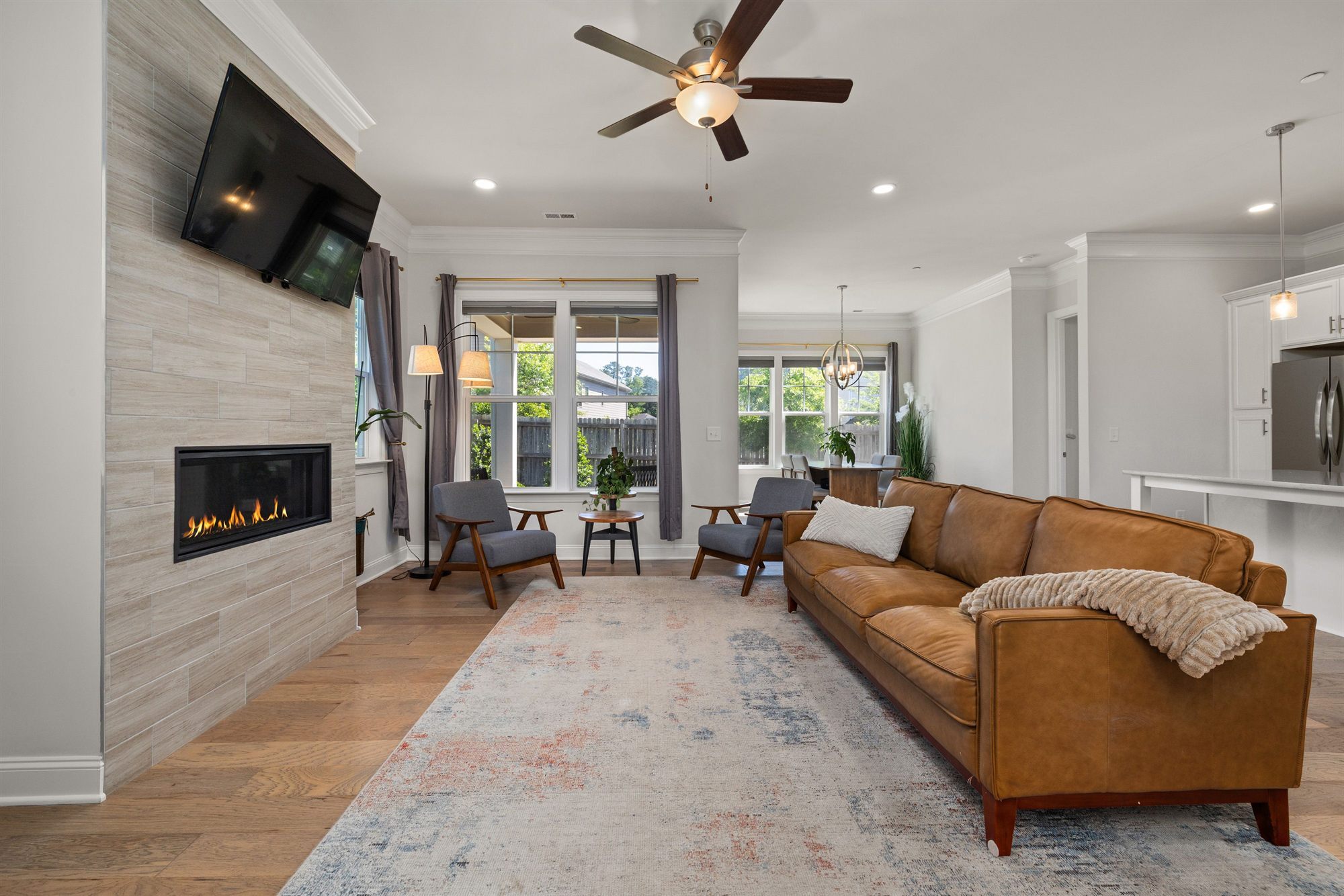 living-room-tile-fireplace-tan-sofa-stock