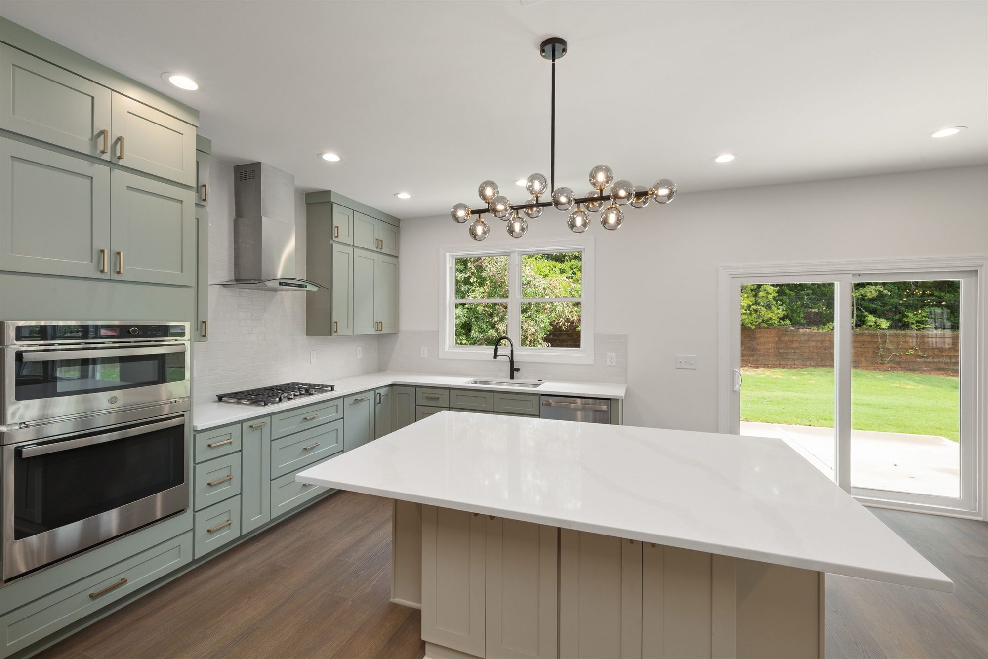 sage-green-kitchen-chandelier-stock