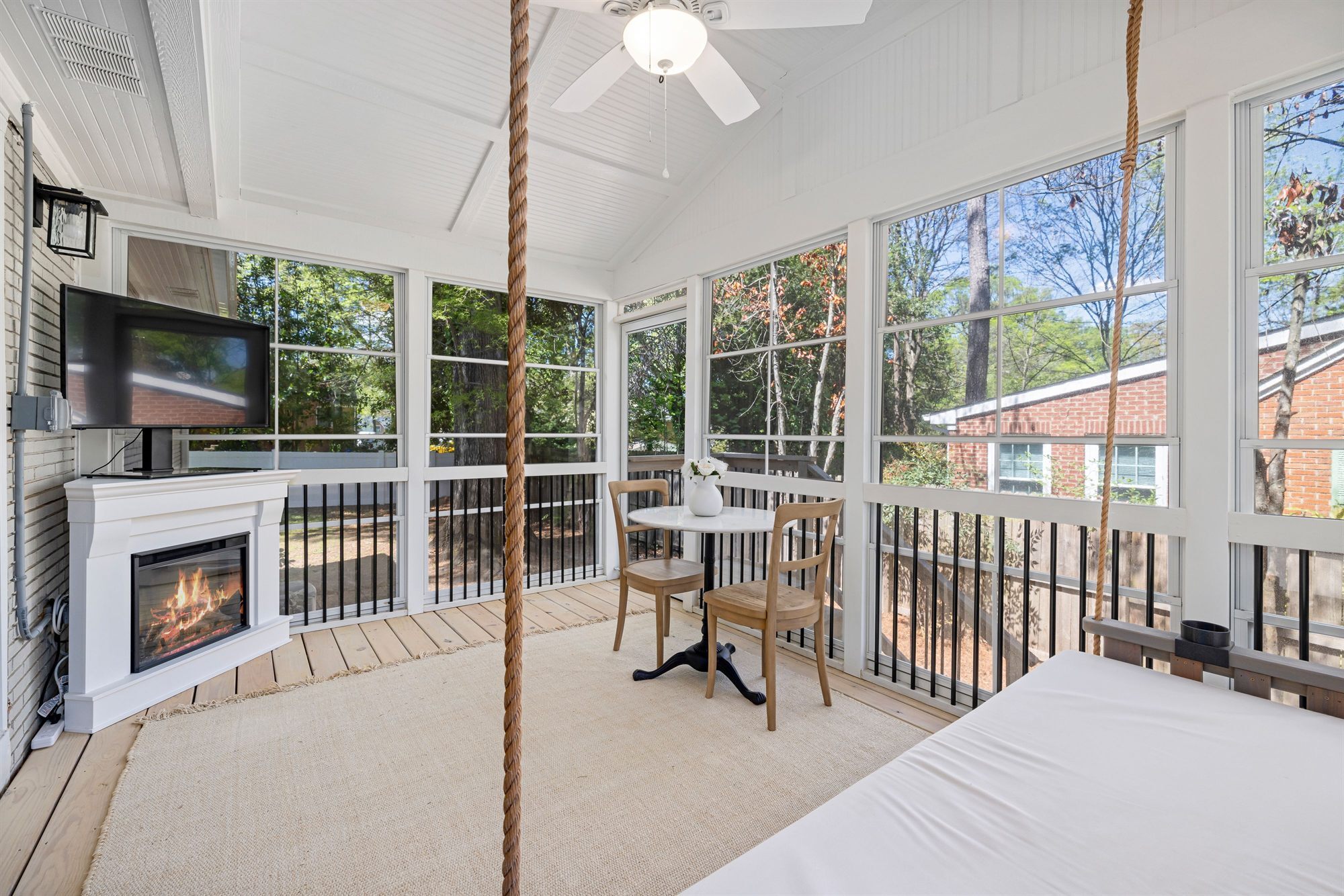 screened-porch-fireplace-swing-stock